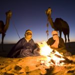 Tuareg camel drivers stop for a night rest in Mali.