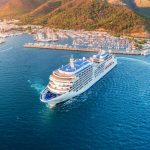 Aerial view of beautiful white cruise ship at sunset