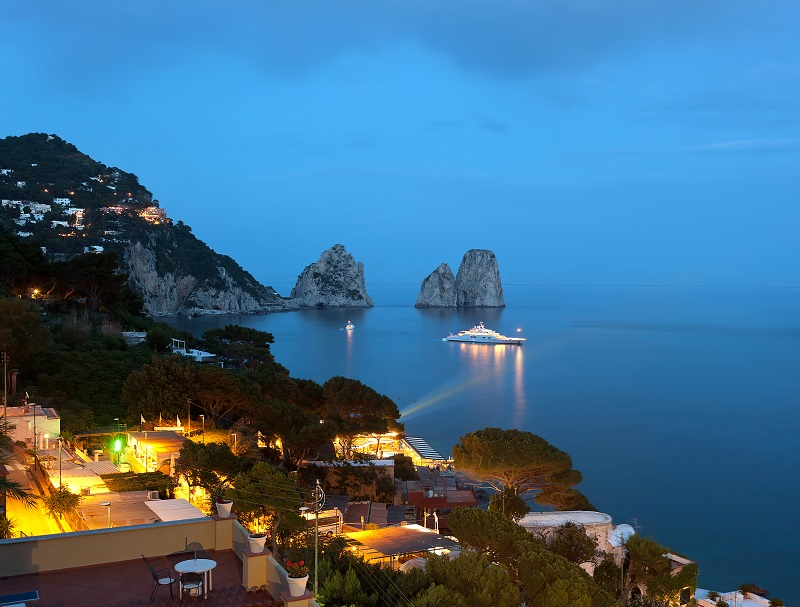 Faraglioni by night, famous giant rocks, Capri island