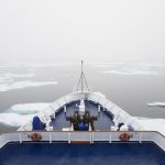 Canadian Arctic waters,,Canada,The view over the decks of a cruise ship in the Canadian Arctic region, moving through ice floes.