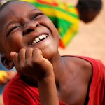 african-boy-smiling-and-having-fun-wearing-colorfu