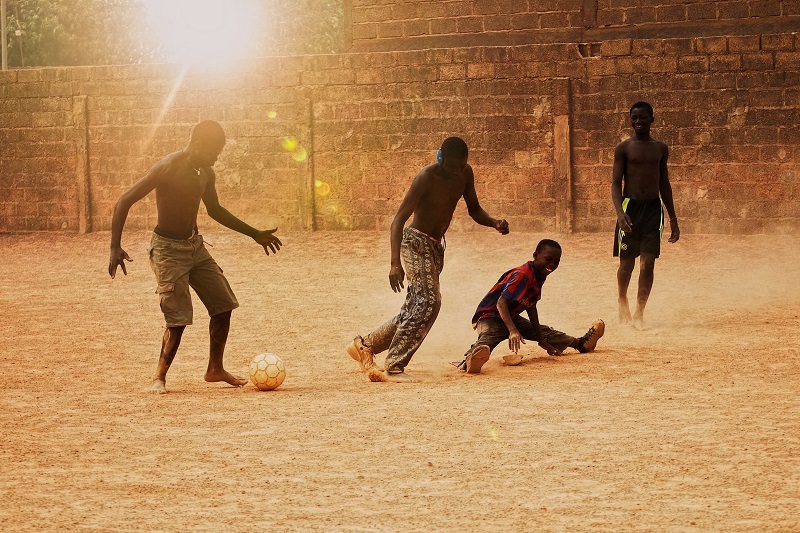 golden-hour-playing-football-during-sunset