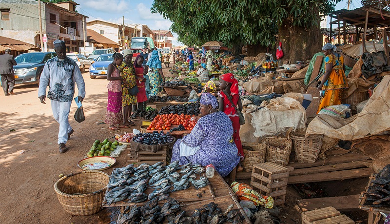 Women selling local goods, market, street scene, Foumban, West Region, Cameroon, Africa