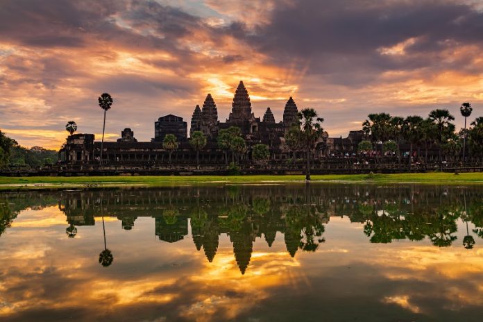 10 Things Cambodia Is Famous For Sunrise on Angkor Wat Temple in Cambodia.