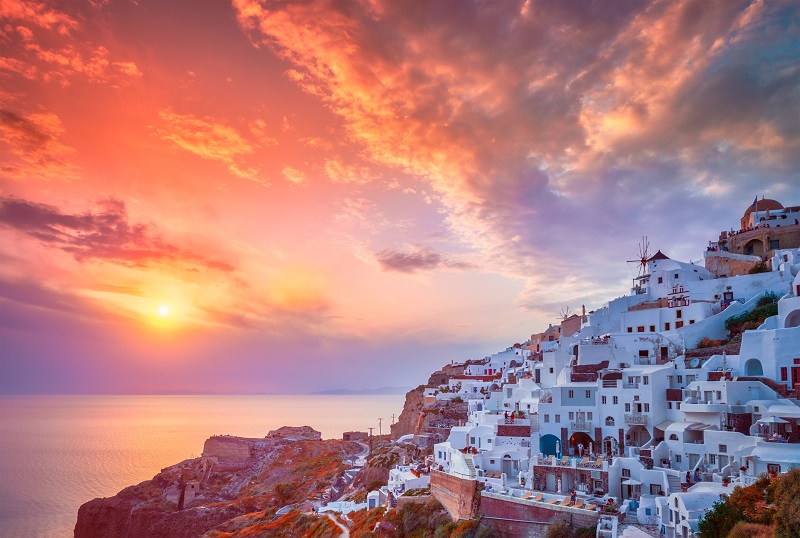 Sunset over Oia town on Santorini island in summer. Santorini, Greece